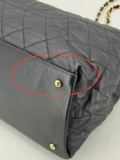 Pre - loved CHANEL Chain Me Black Quilted Tote Bag at Reems Closet