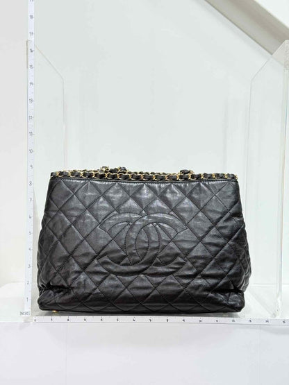 Pre - loved CHANEL Chain Me Black Quilted Tote Bag at Reems Closet