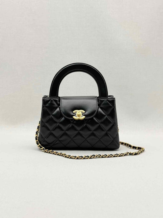 Pre - loved CHANEL Kelly Black Quilted Top Handle at Reems Closet