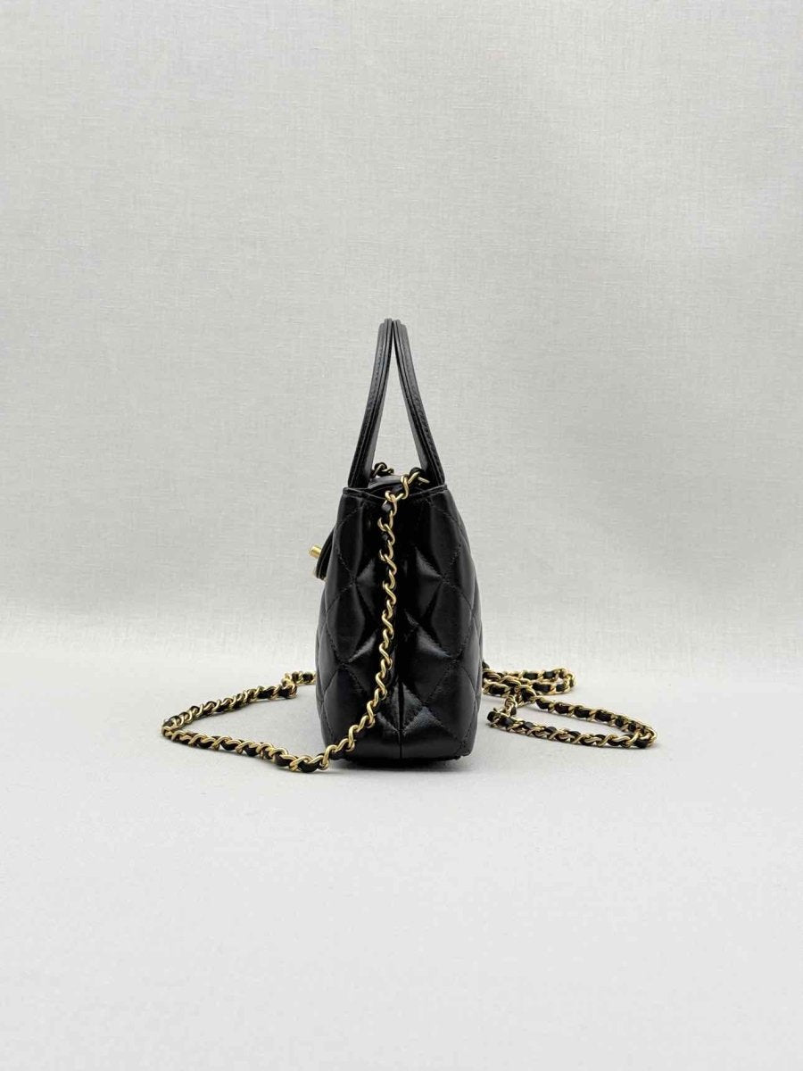 Pre - loved CHANEL Kelly Black Quilted Top Handle at Reems Closet