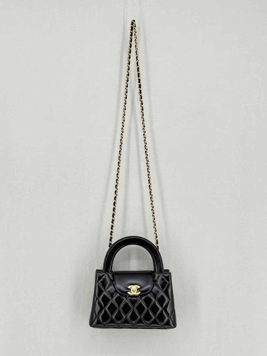 Pre - loved CHANEL Kelly Black Quilted Top Handle at Reems Closet