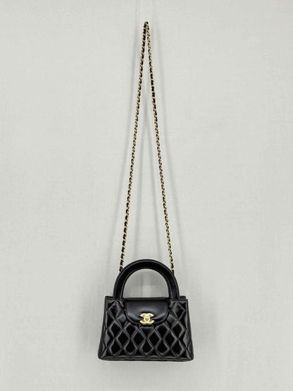 Pre - loved CHANEL Kelly Black Quilted Top Handle at Reems Closet