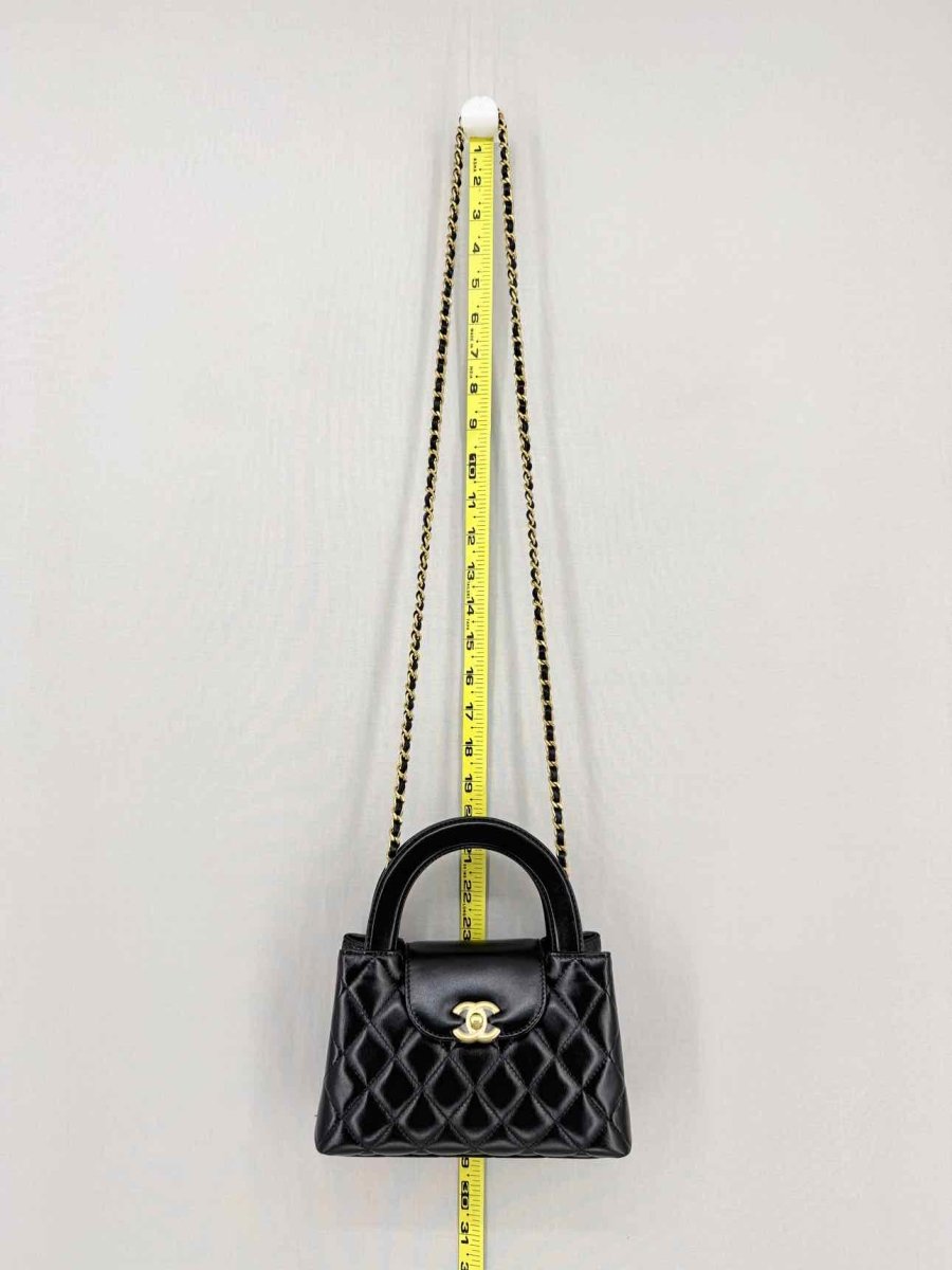 Pre - loved CHANEL Kelly Black Quilted Top Handle at Reems Closet