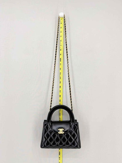 Pre - loved CHANEL Kelly Black Quilted Top Handle at Reems Closet