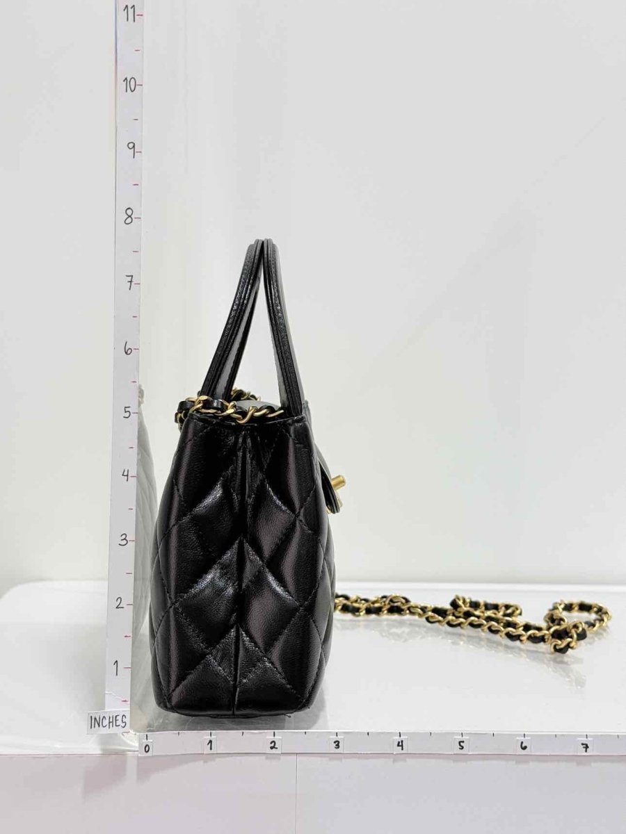 Pre - loved CHANEL Kelly Black Quilted Top Handle at Reems Closet