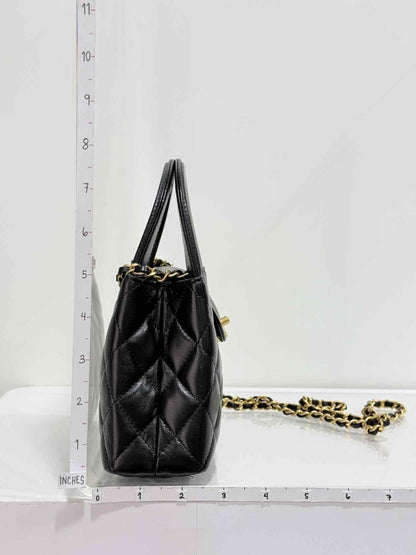 Pre - loved CHANEL Kelly Black Quilted Top Handle at Reems Closet