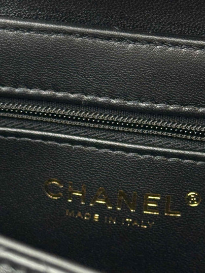 Pre - loved CHANEL Kelly Black Quilted Top Handle at Reems Closet