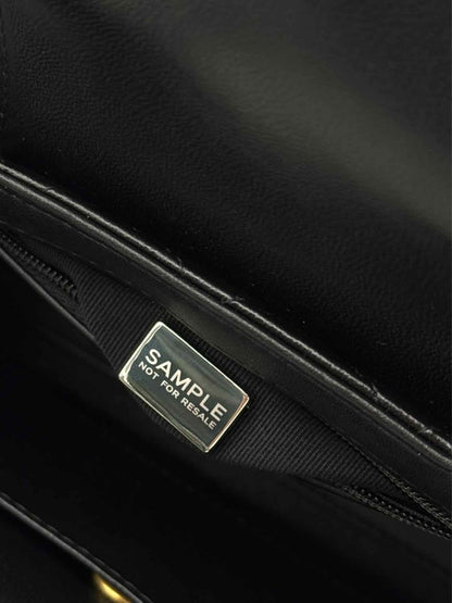 Pre - loved CHANEL Kelly Black Quilted Top Handle at Reems Closet