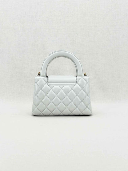 Pre - loved CHANEL Kelly Grey Quilted Top Handle at Reems Closet