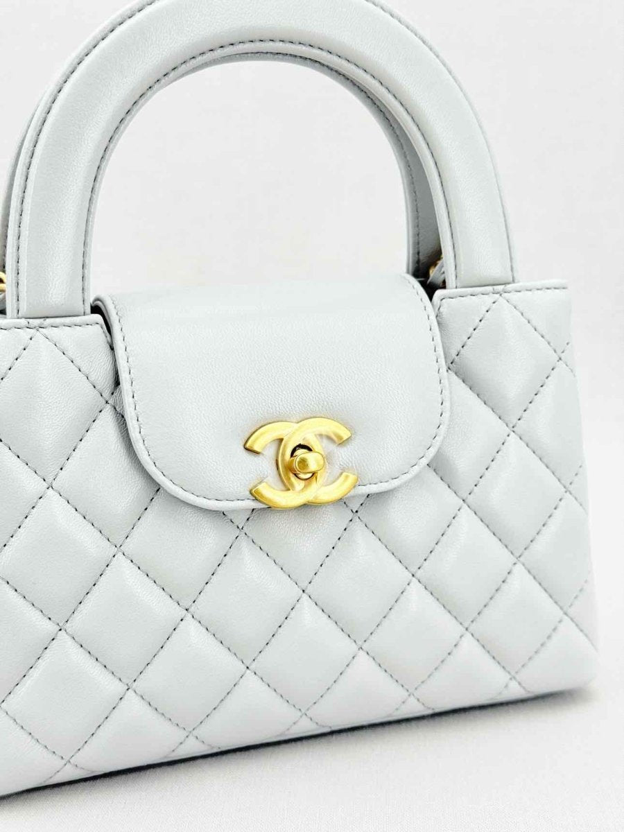Pre - loved CHANEL Kelly Grey Quilted Top Handle at Reems Closet