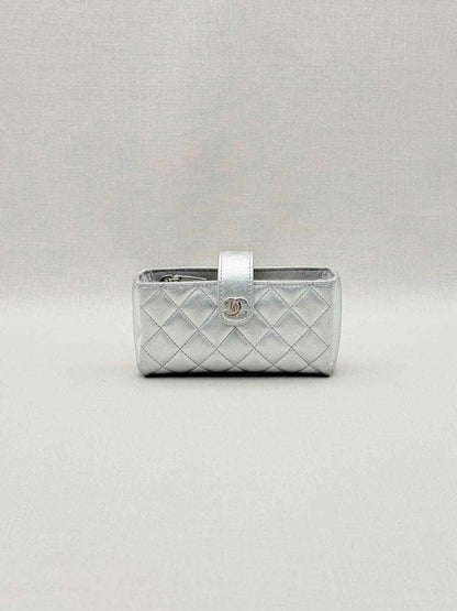 Pre-loved CHANEL Metallic Silver Quilted Phone case at Reems Closet