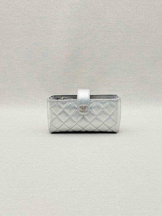 Pre-loved CHANEL Metallic Silver Quilted Phone case at Reems Closet