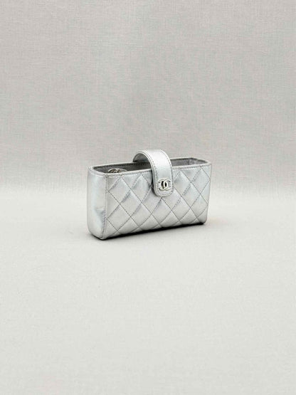 Pre-loved CHANEL Metallic Silver Quilted Phone case at Reems Closet