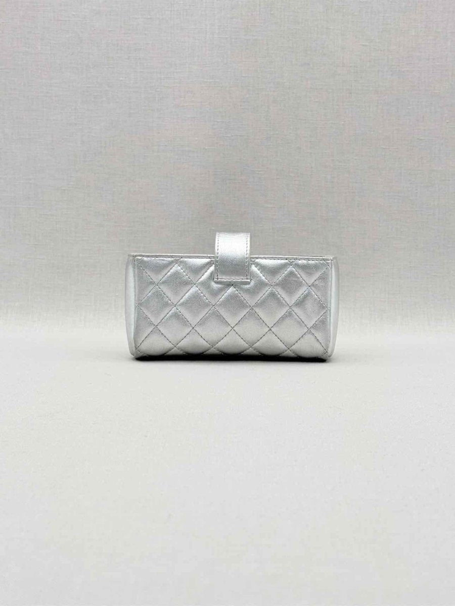 Pre-loved CHANEL Metallic Silver Quilted Phone case at Reems Closet