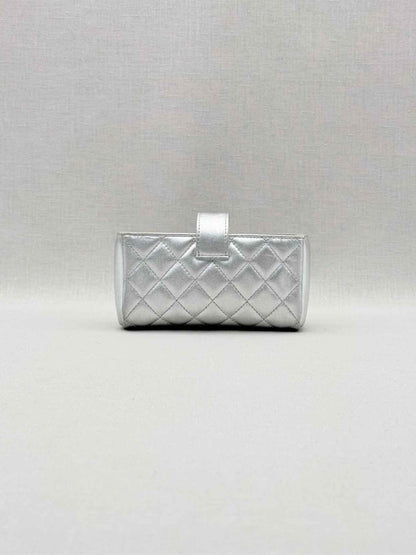 Pre-loved CHANEL Metallic Silver Quilted Phone case at Reems Closet