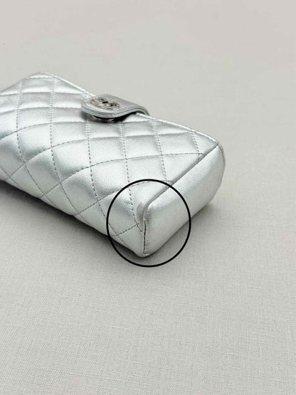 Pre-loved CHANEL Metallic Silver Quilted Phone case at Reems Closet