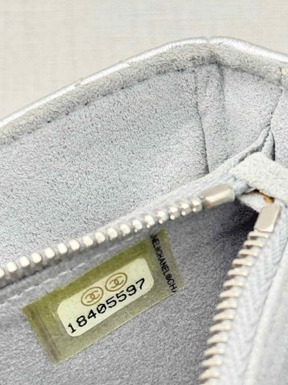 Pre-loved CHANEL Metallic Silver Quilted Phone case at Reems Closet