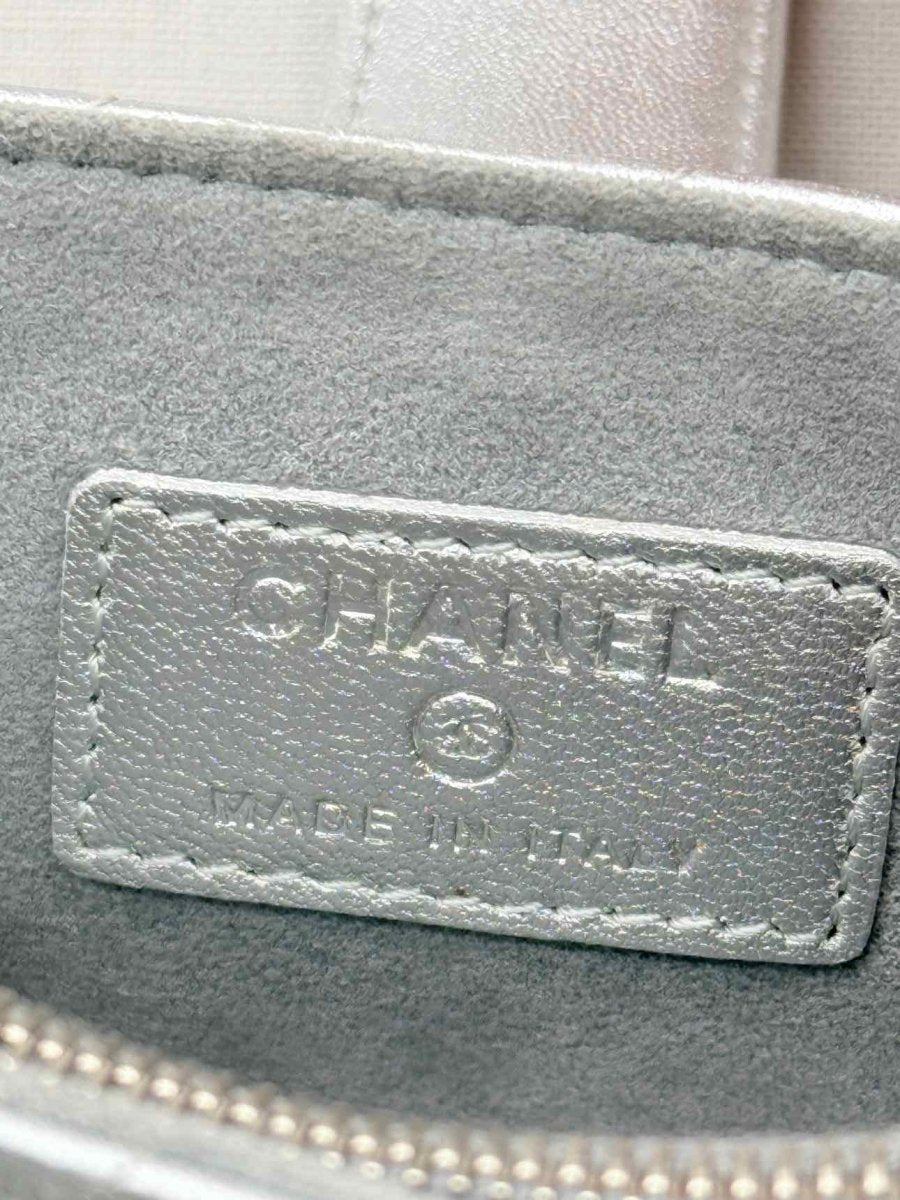 Pre-loved CHANEL Metallic Silver Quilted Phone case at Reems Closet
