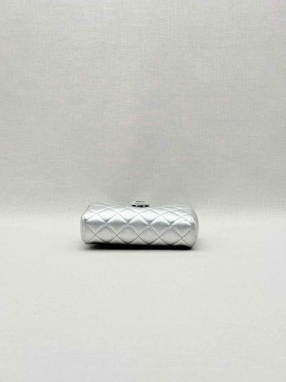 Pre-loved CHANEL Metallic Silver Quilted Phone case at Reems Closet