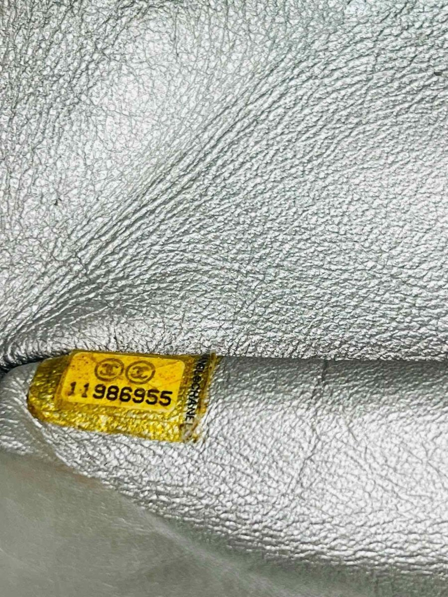 Pre-loved CHANEL Reissue 2.55 Silver Quilted Shoulder Bag at Reems Closet