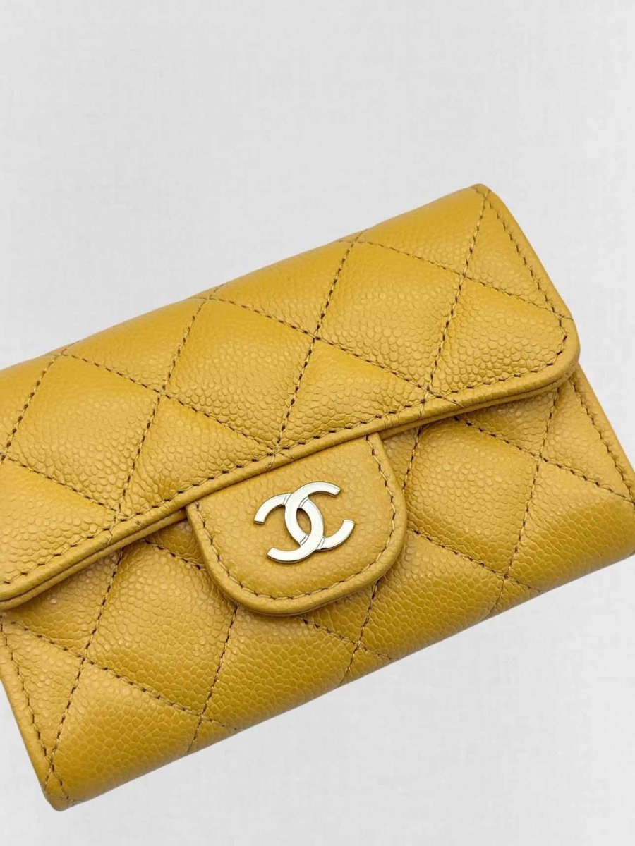 Pre-loved CHANEL Yellow Quilted Compact Wallet at Reems Closet