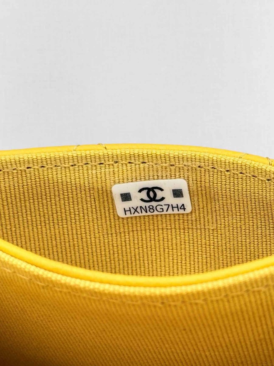 Pre-loved CHANEL Yellow Quilted Compact Wallet at Reems Closet