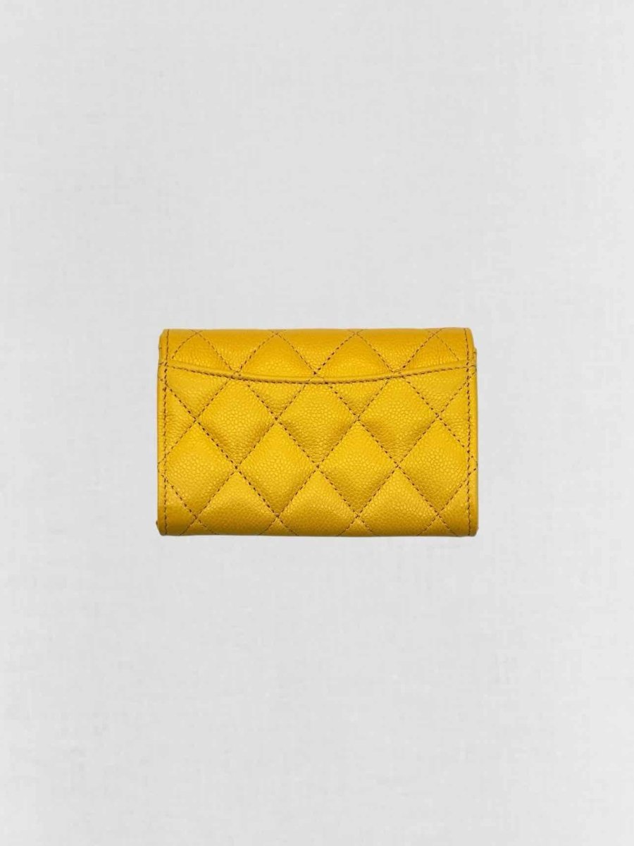 Pre-loved CHANEL Yellow Quilted Compact Wallet at Reems Closet