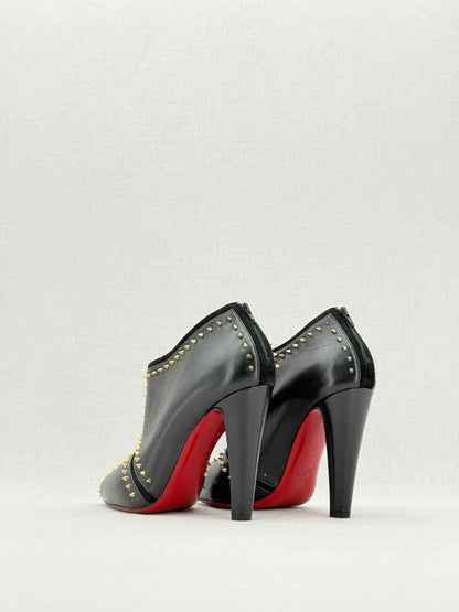 Pre - loved CHRISTIAN LOUBOUTIN Black & Gold Size EU 38 Ankle Boots at Reems Closet