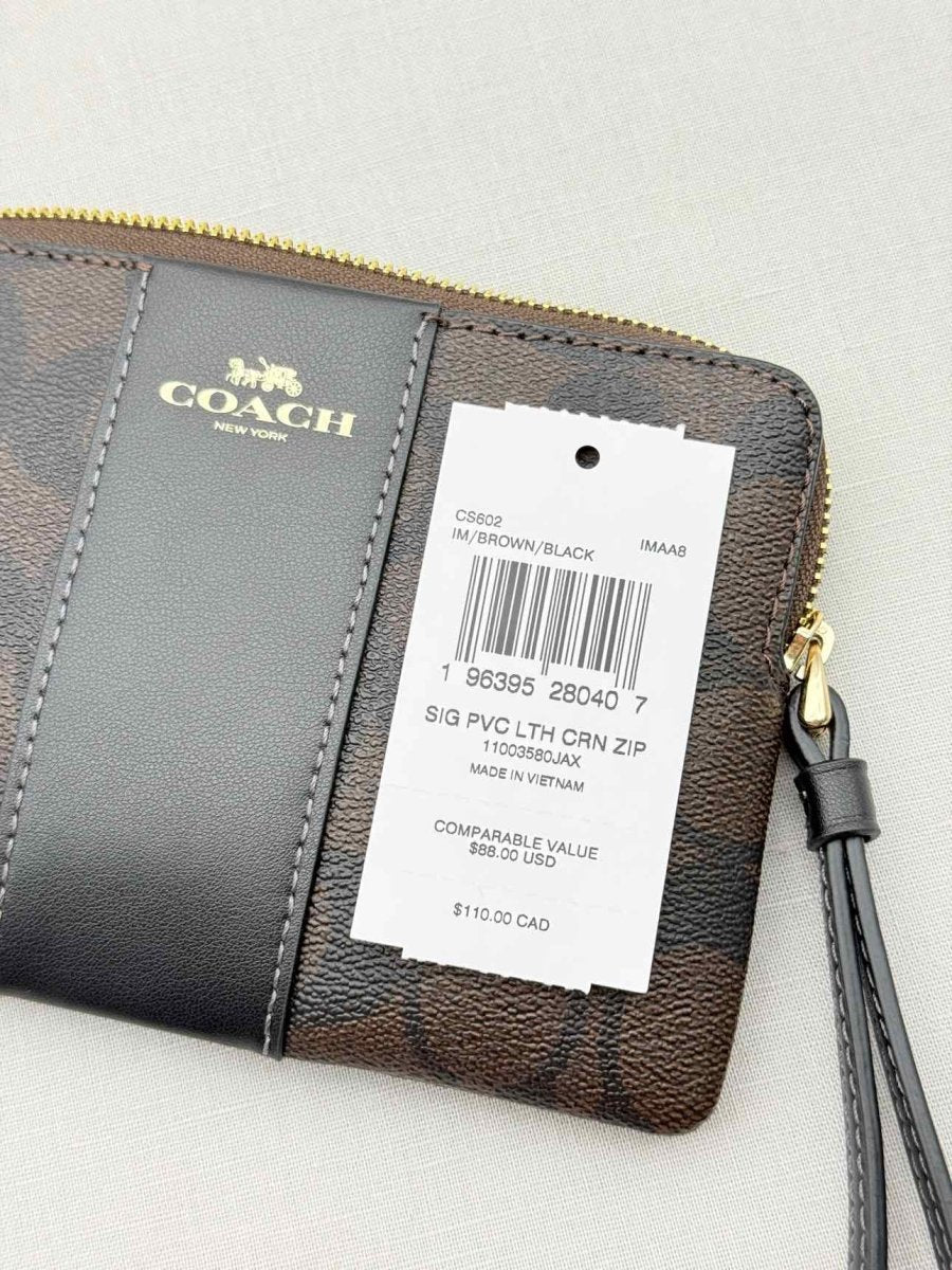 Pre - loved COACH Corner Zip Brown Signature Wristlet at Reems Closet