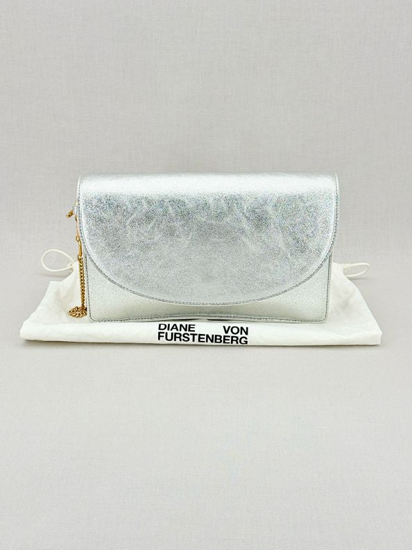 Pre - loved DIANE VON FURSTENBERG Saddle Silver Clutch at Reems Closet