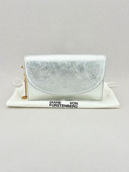 Pre - loved DIANE VON FURSTENBERG Saddle Silver Clutch at Reems Closet