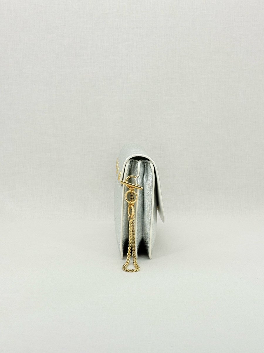 Pre - loved DIANE VON FURSTENBERG Saddle Silver Clutch at Reems Closet