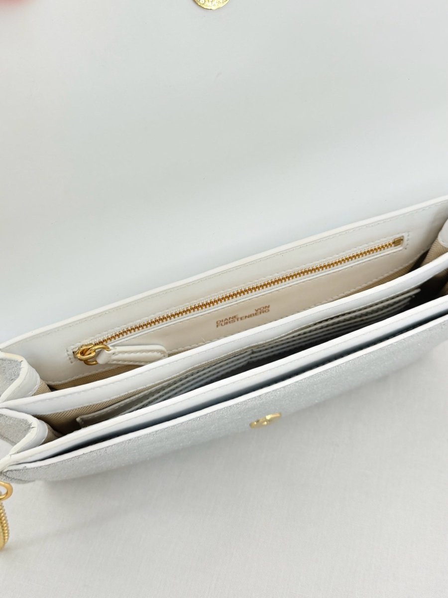 Pre - loved DIANE VON FURSTENBERG Saddle Silver Clutch at Reems Closet