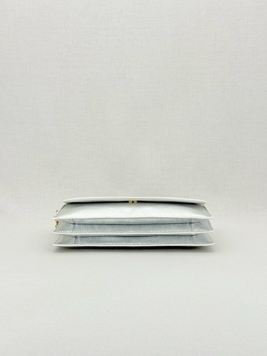 Pre - loved DIANE VON FURSTENBERG Saddle Silver Clutch at Reems Closet