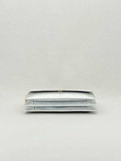 Pre - loved DIANE VON FURSTENBERG Saddle Silver Clutch at Reems Closet