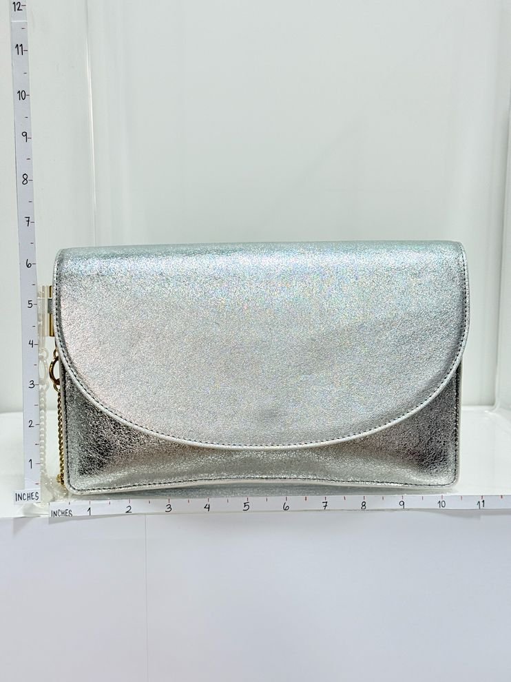 Pre - loved DIANE VON FURSTENBERG Saddle Silver Clutch at Reems Closet