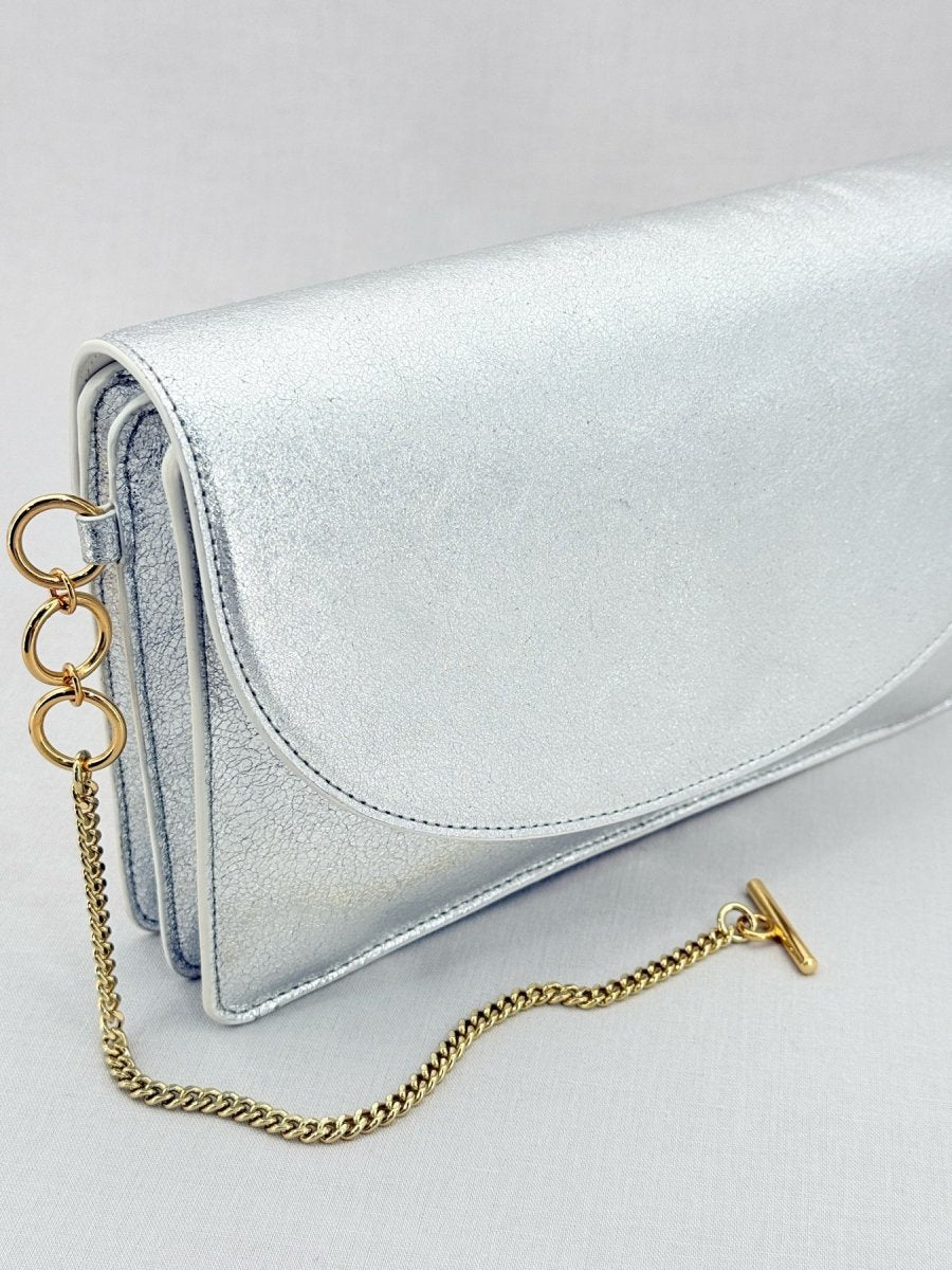 Pre - loved DIANE VON FURSTENBERG Saddle Silver Clutch at Reems Closet