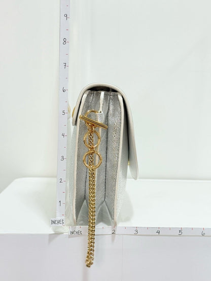 Pre - loved DIANE VON FURSTENBERG Saddle Silver Clutch at Reems Closet