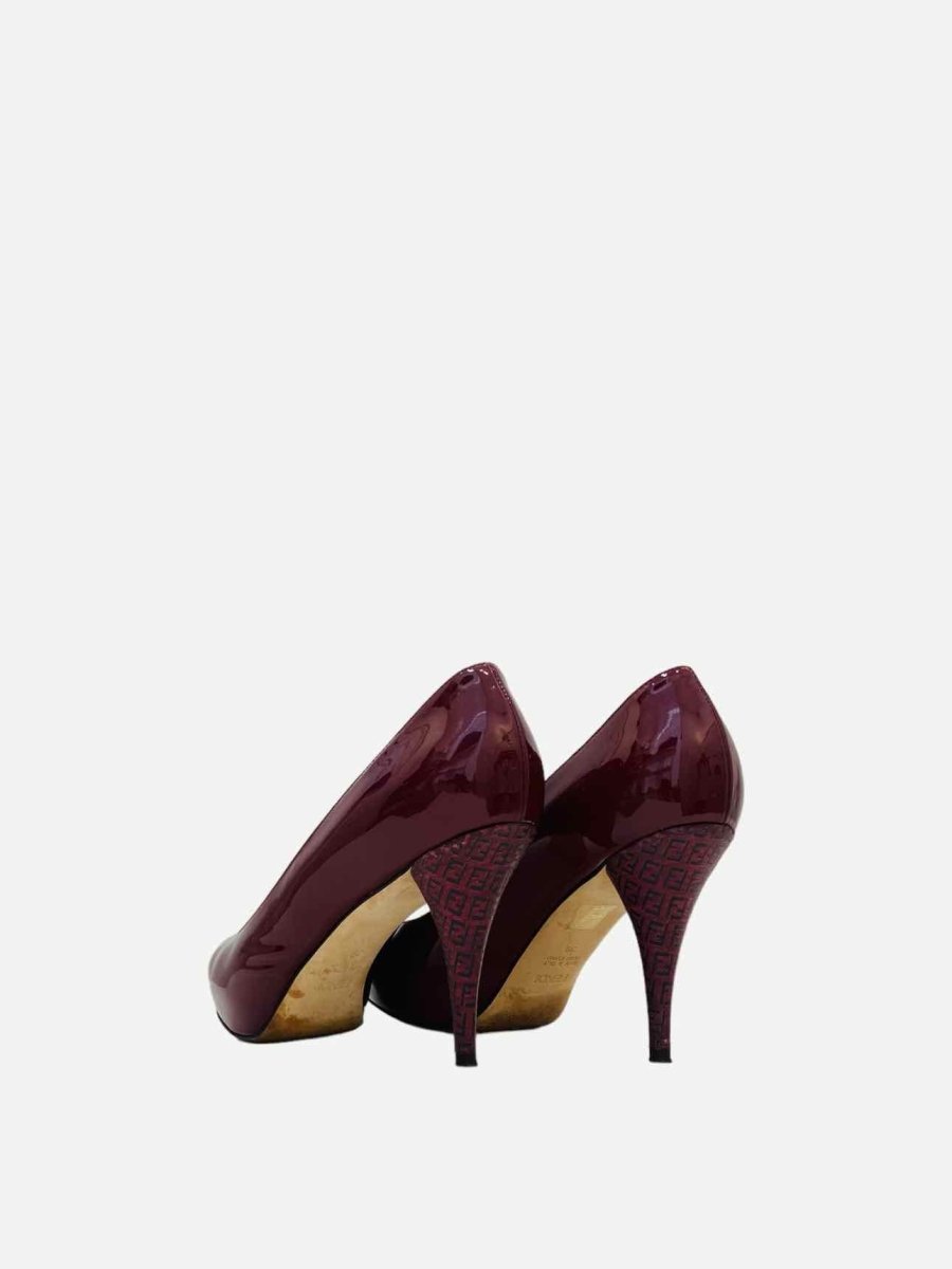 Pre-loved FENDI Ruby Red FF Motif Pumps from Reems Closet