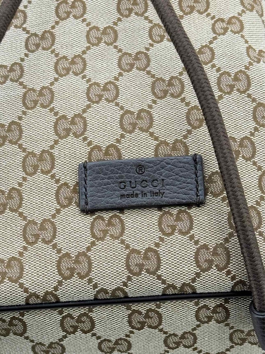 Pre - loved GUCCI Drawstring Brown GG Backpack at Reems Closet