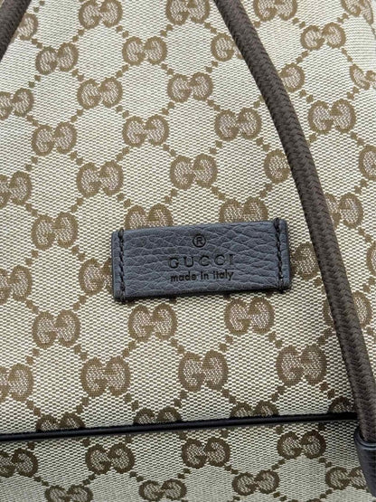 Pre - loved GUCCI Drawstring Brown GG Backpack at Reems Closet