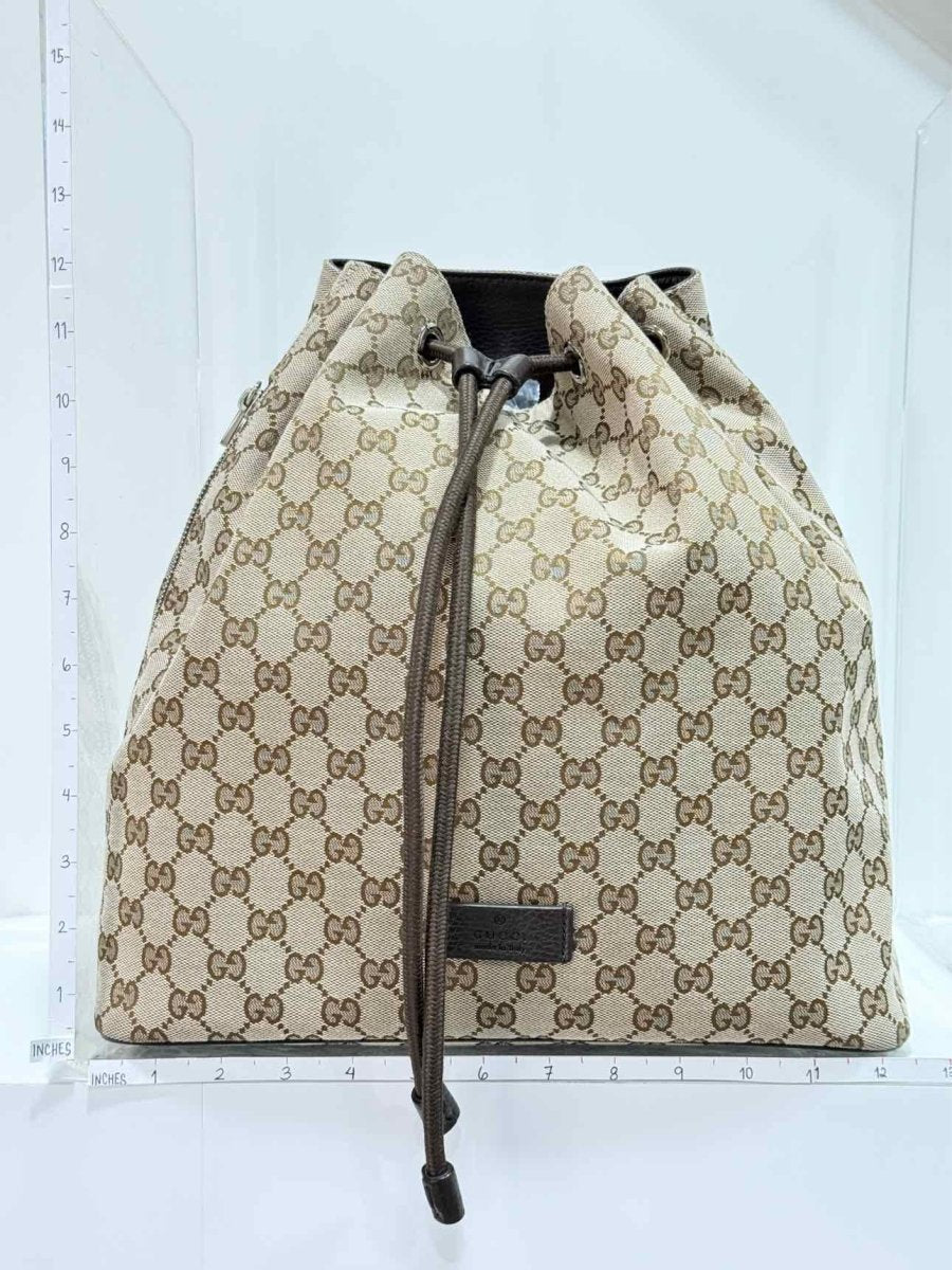 Pre - loved GUCCI Drawstring Brown GG Backpack at Reems Closet