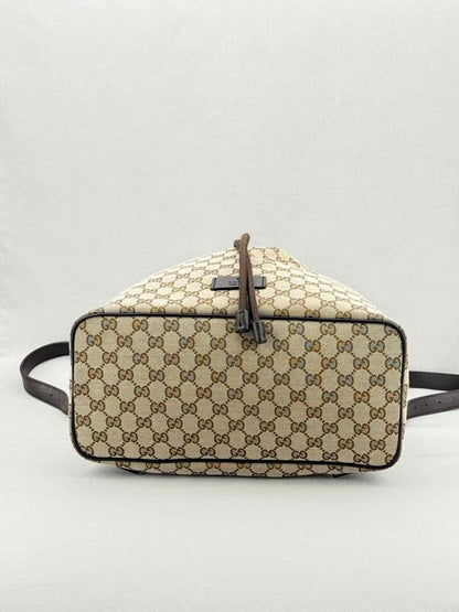 Pre - loved GUCCI Drawstring Brown GG Backpack at Reems Closet