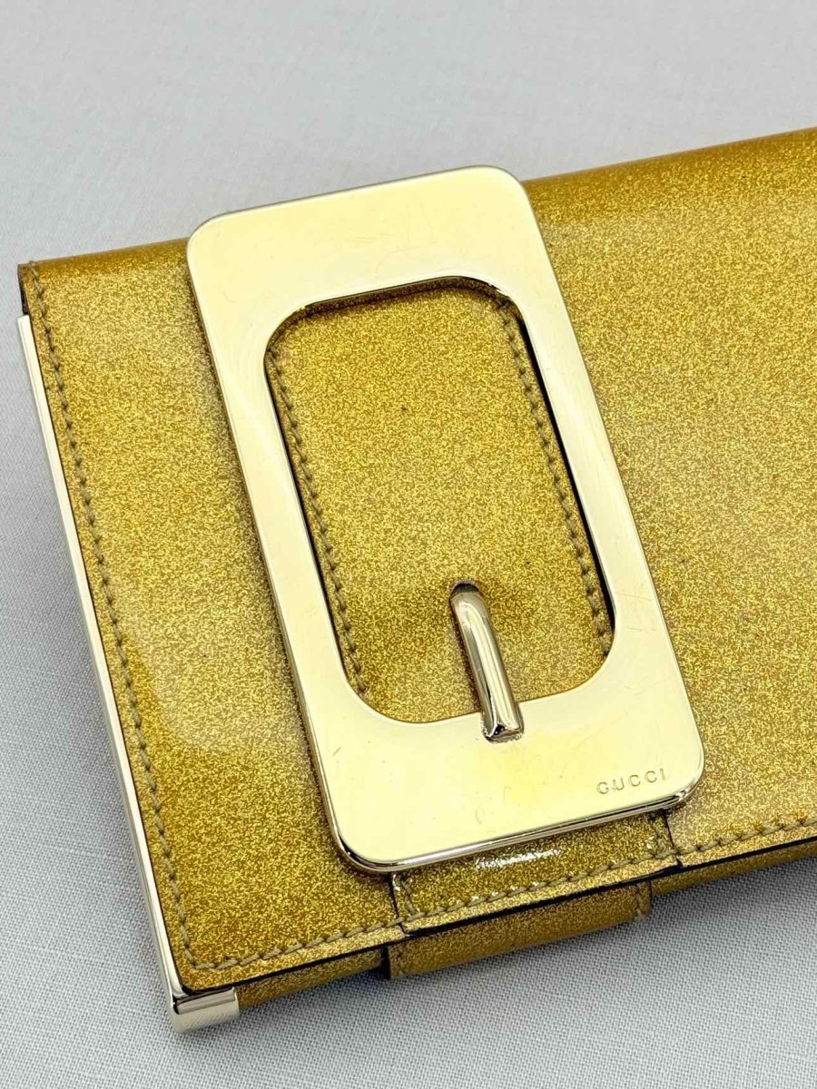 Pre - loved GUCCI GG Romy Gold Clutch at Reems Closet