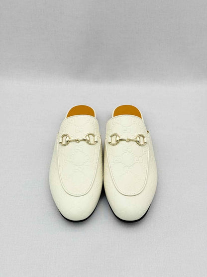 Pre-loved GUCCI Horsebit White GG Embossed Size EU 37.5 Mules at Reems Closet