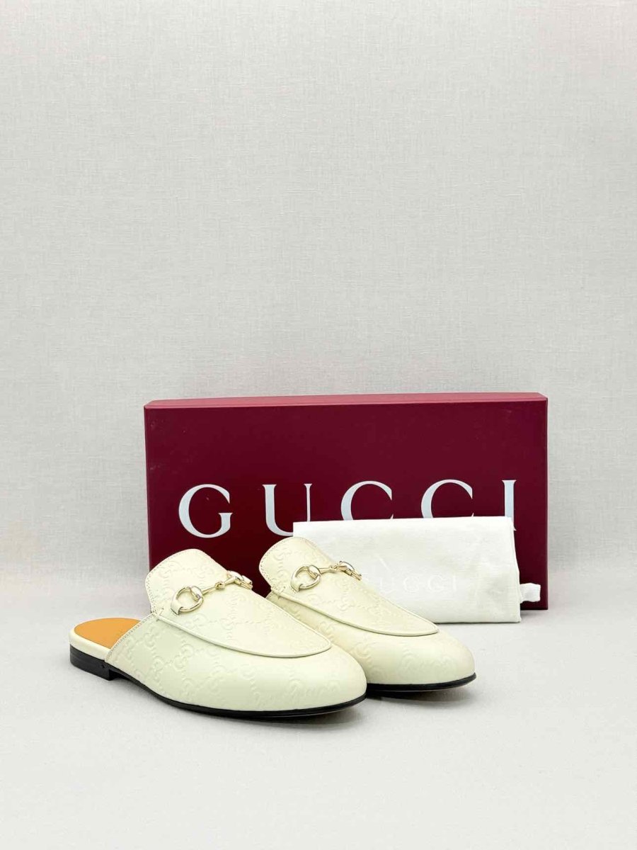 Pre-loved GUCCI Horsebit White GG Embossed Size EU 37.5 Mules at Reems Closet
