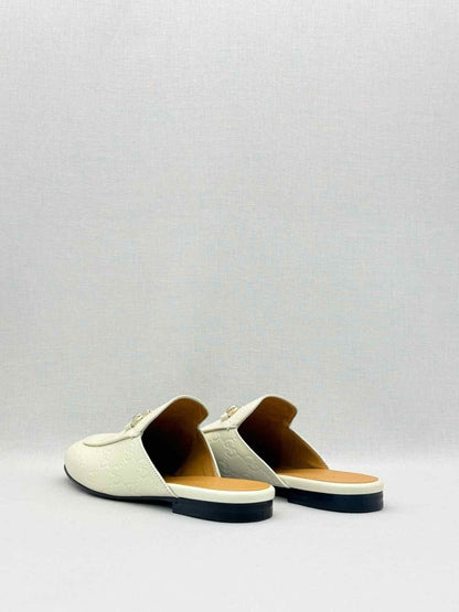 Pre-loved GUCCI Horsebit White GG Embossed Size EU 37.5 Mules at Reems Closet