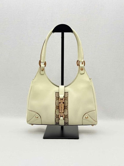 Pre-loved GUCCI Jackie Nailhead Beige GG Hobo bag at Reems Closet