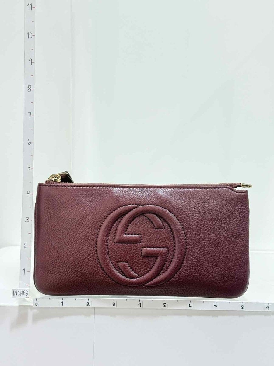 Pre - loved GUCCI Soho Burgundy GG Embossed Wristlet at Reems Closet