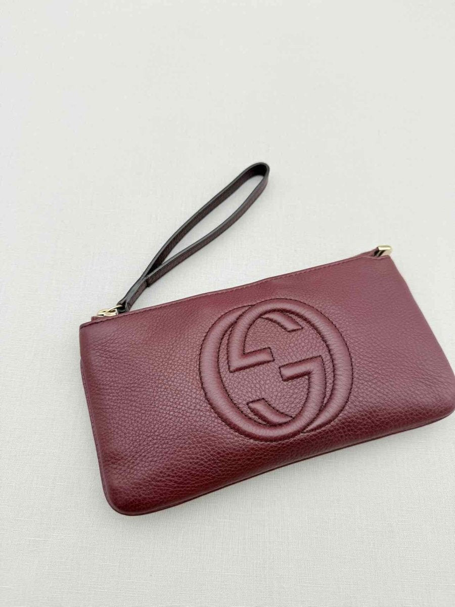 Pre - loved GUCCI Soho Burgundy GG Embossed Wristlet at Reems Closet
